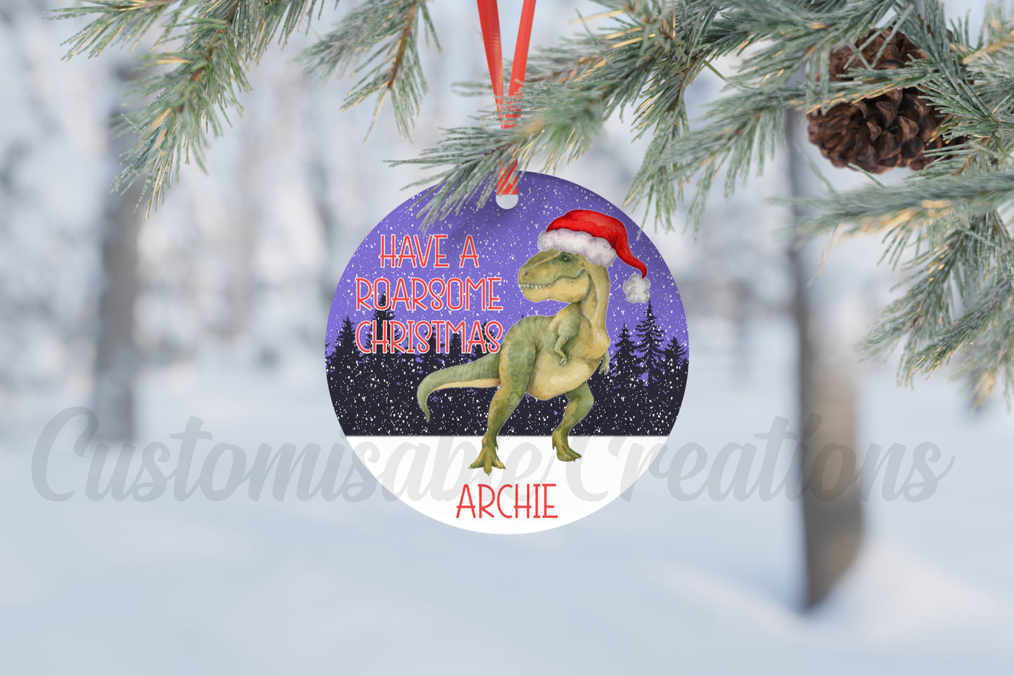 christmas bauble with a dinosaur with a santa hat on, with a meaagae saying  have a roarsome christmas and can be personalised with a name